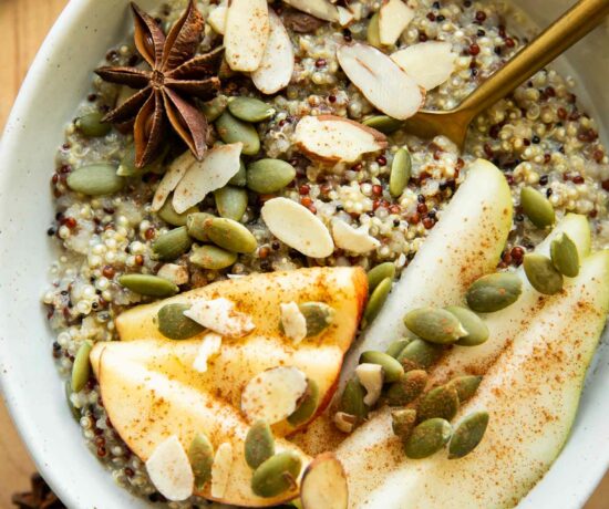 Quinoa breakfast bowl with fall spices and toppings.