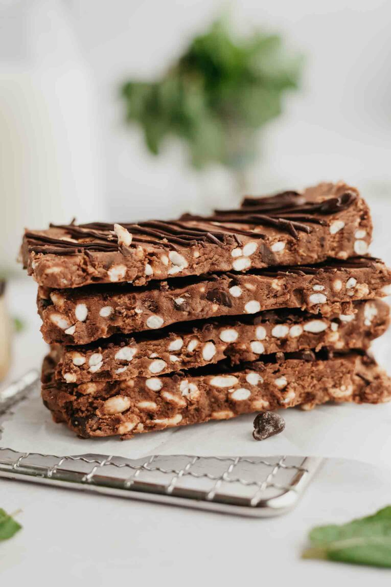 Stack of chocolate protein bars with mint.