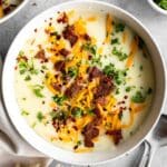 4-Ingredient Potato Soup recipe with bacon bits, cheese, and parsley.