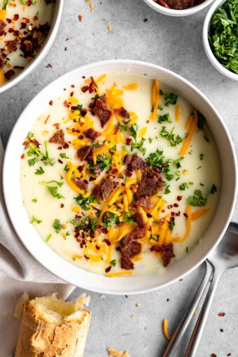 4-Ingredient Potato Soup recipe with bacon bits, cheese, and parsley.