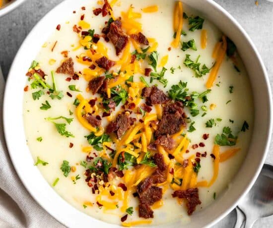 4-Ingredient Potato Soup recipe with bacon bits, cheese, and parsley.