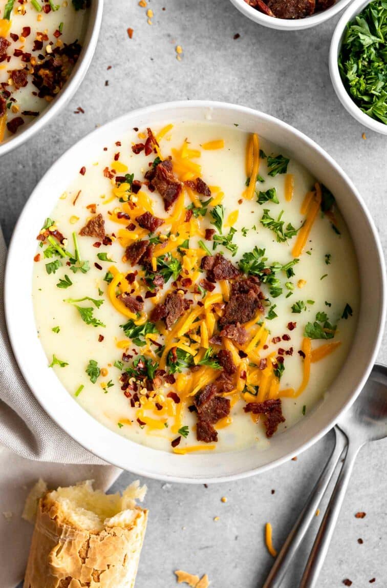 4-Ingredient Potato Soup recipe with bacon bits, cheese, and parsley.