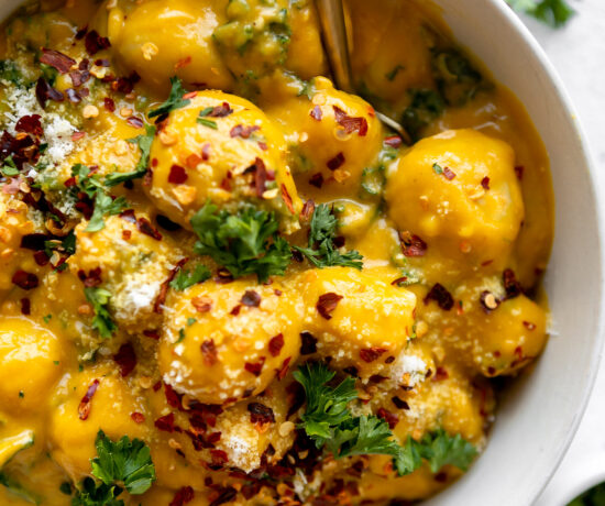 Potato gnocchi with a butternut squash sauce and sautéed kale.