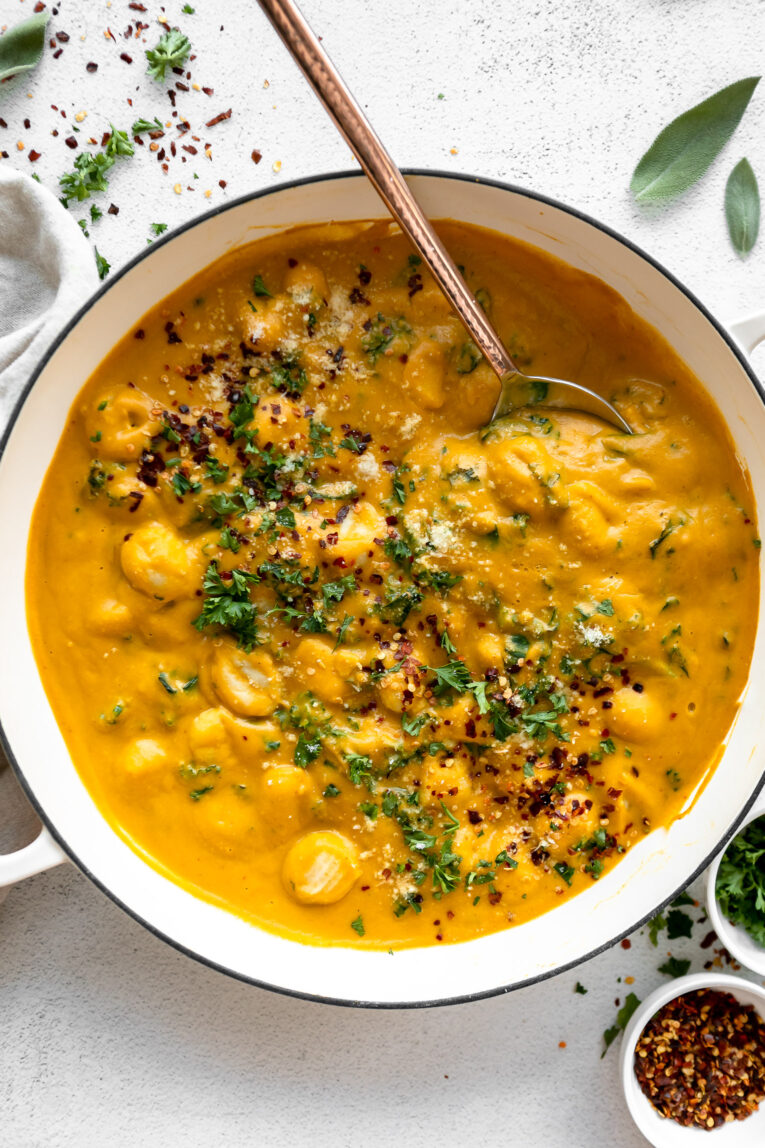 Butternut squash gnocchi being cooked in a dutch oven.