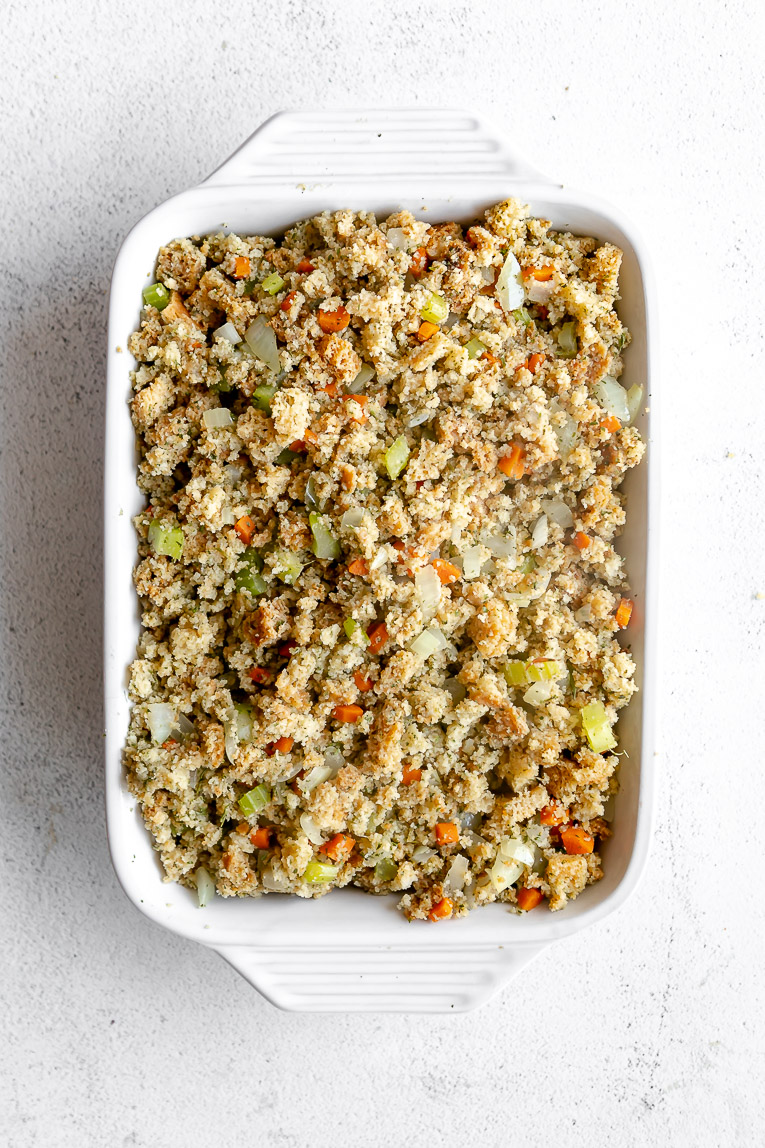 Chicken broccoli casserole topped with stuffing in a casserole dish.