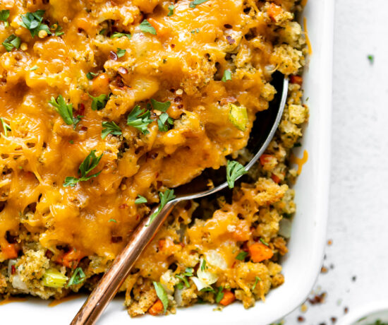 Close up of Chicken Broccoli Stuffing Casserole with a large serving spoon.