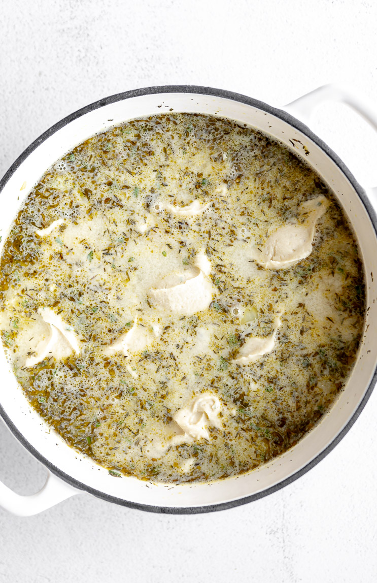Dumplings placed in chicken soup.