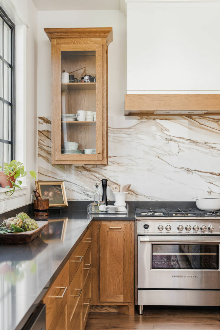 Modern traditional kitchen with marble backsplash.