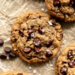 Oat Flour Chocolate Chip Cookies recipe on parchment paper.