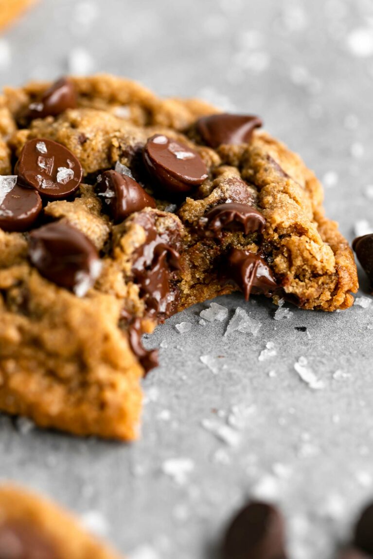 Close up of gluten-free Oat Flour Chocolate Chip Cookie with bite taken out.