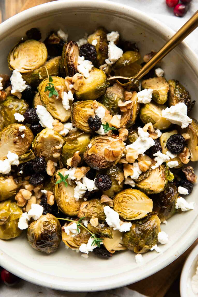 Close up of roasted brussels sprouts in a big bowl.