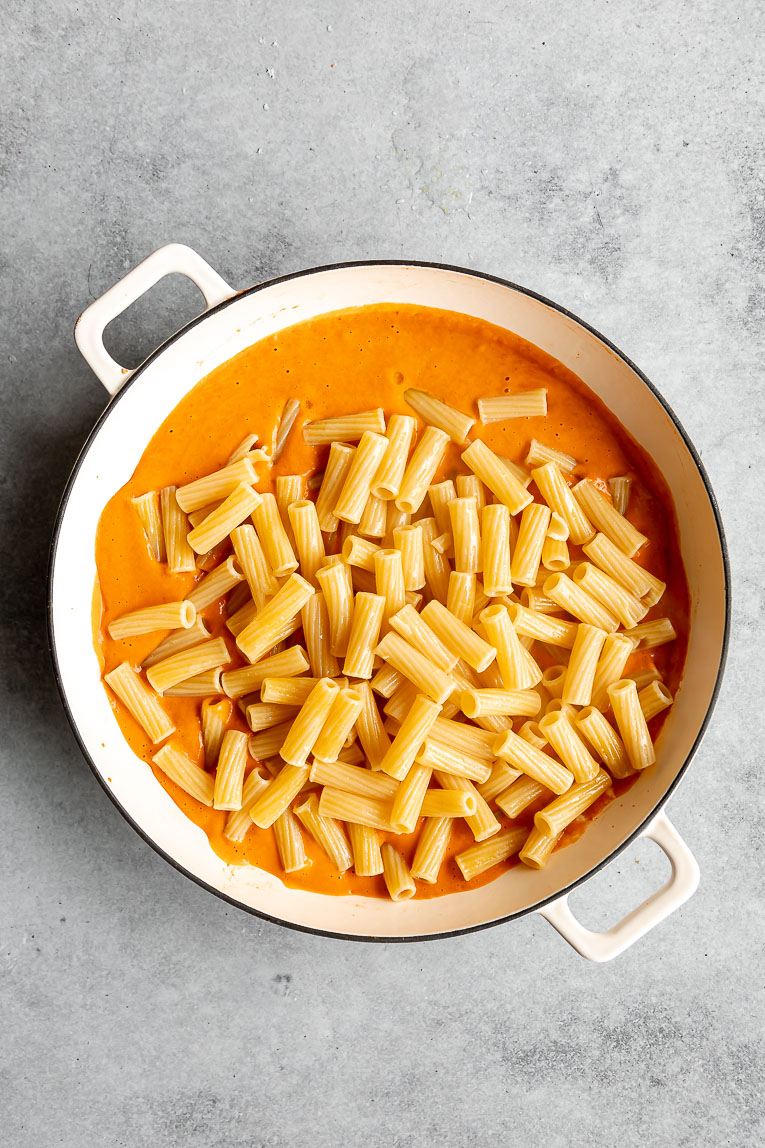 Pasta added to spicy vodka sauce recipe.