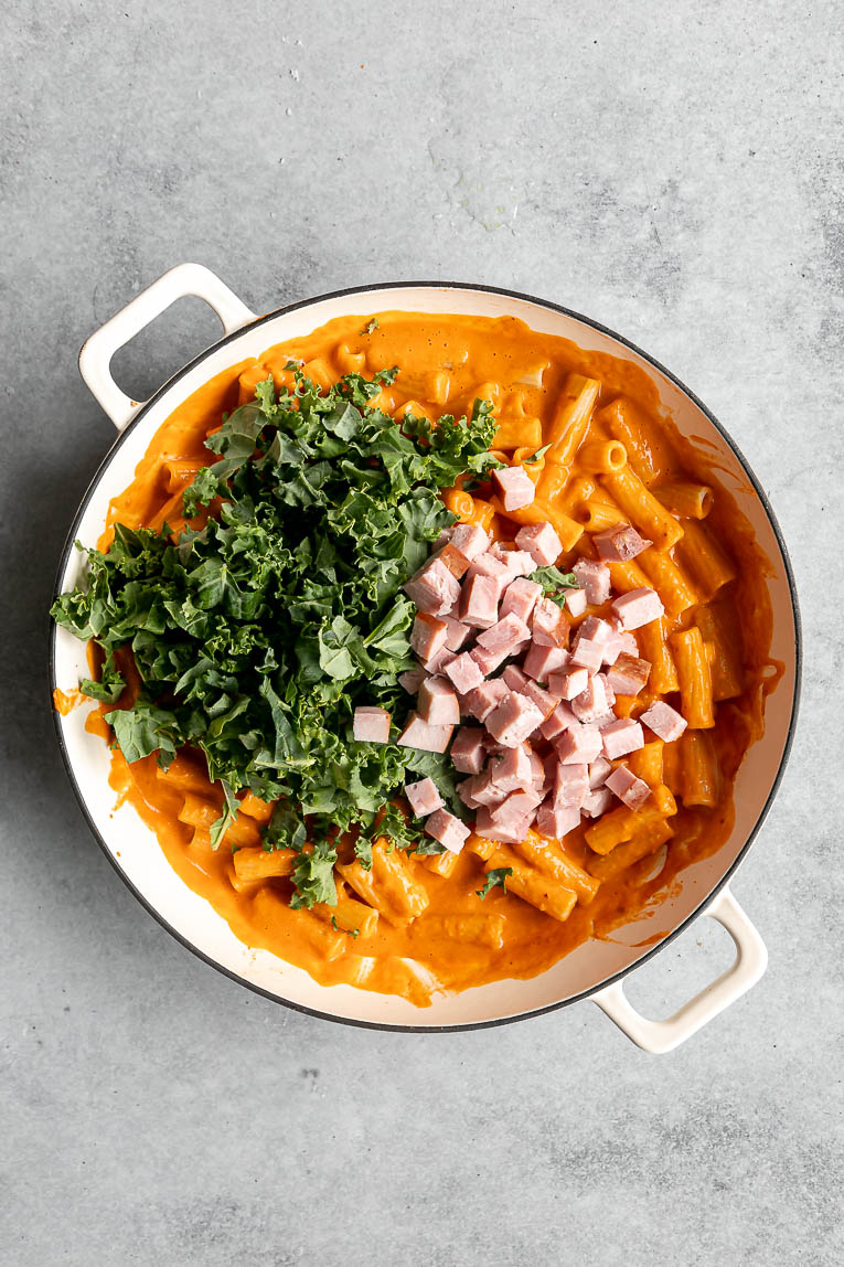 Cooked ham and kale added to spicy vodka pasta.