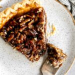 Top photo of vegan pecan pie slice on a plate.