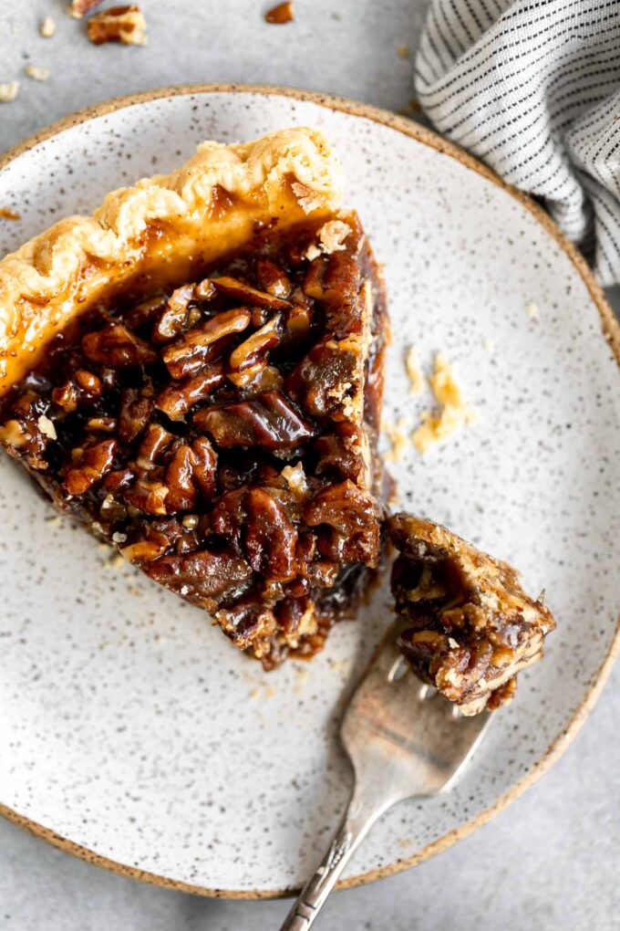 Top photo of vegan pecan pie slice on a plate.