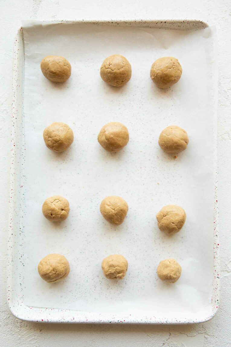 Cake flavored protein bites on parchment paper.