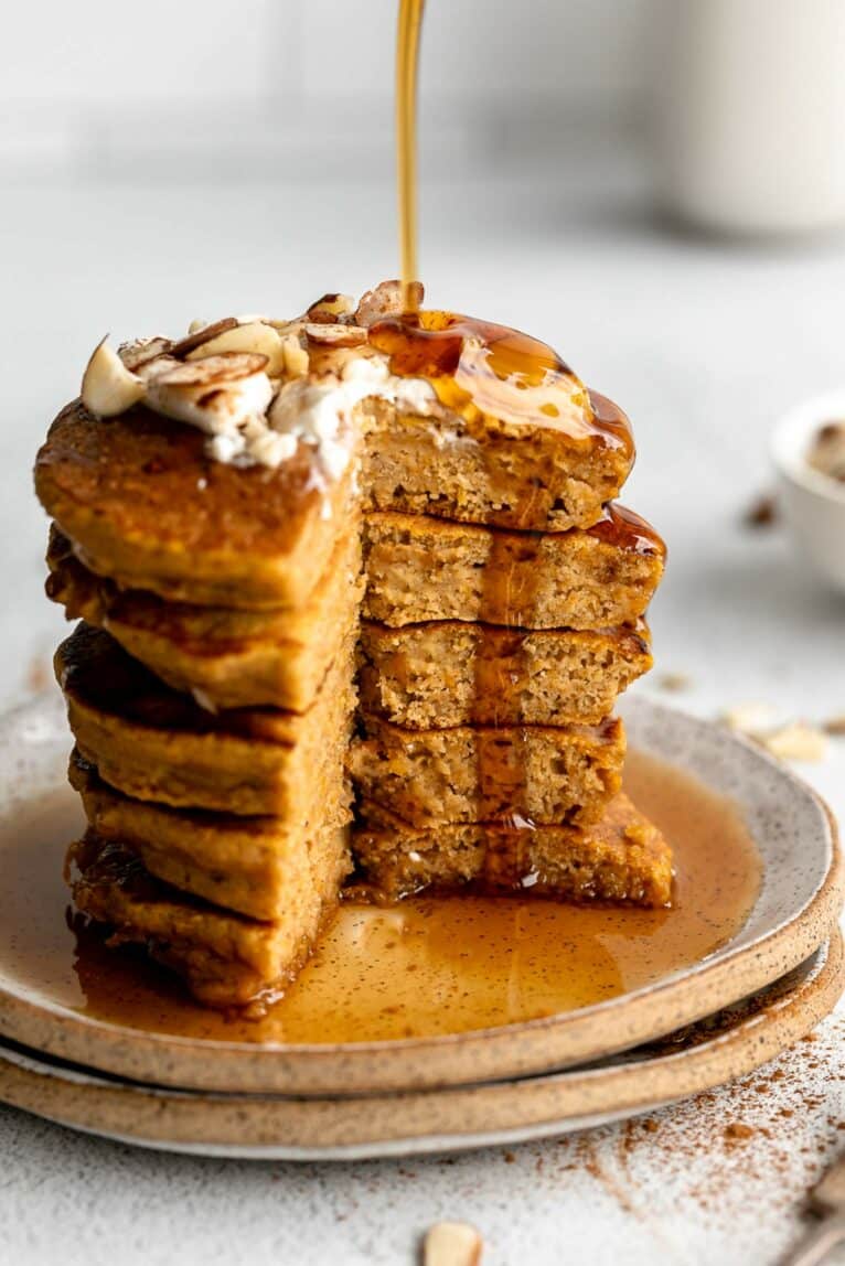 Butternut squash pancakes with syrup pour.