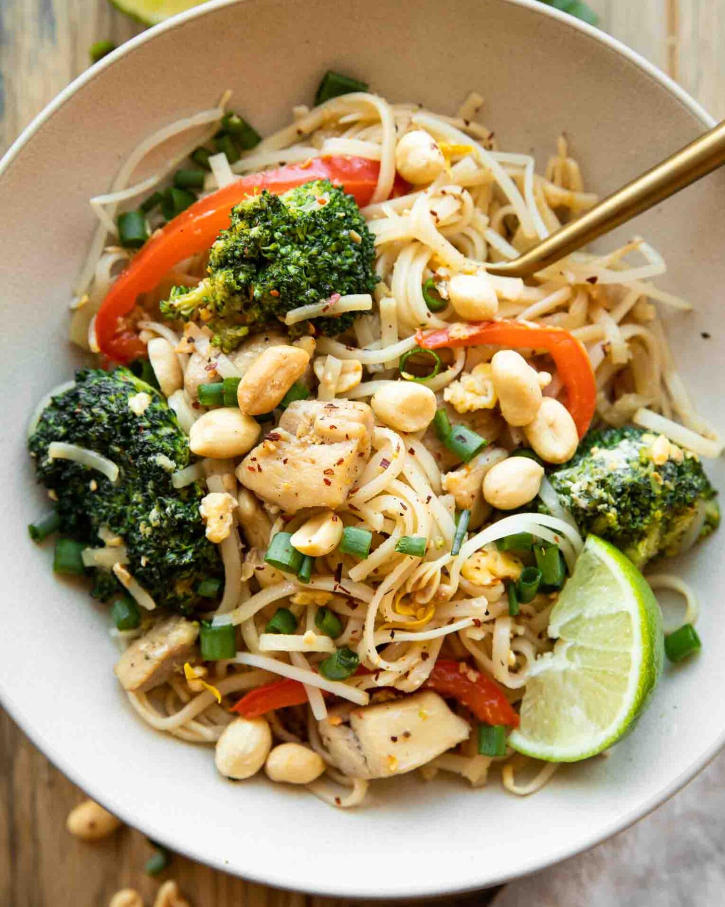Easy Chicken Pad Thai recipe in a bowl with a fork.