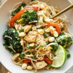 Easy Chicken Pad Thai recipe in a bowl with a fork.