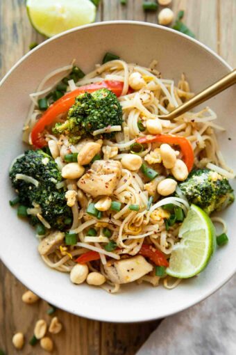 Easy Chicken Pad Thai recipe in a bowl with a fork.