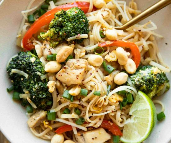 Easy Chicken Pad Thai recipe in a bowl with a fork.