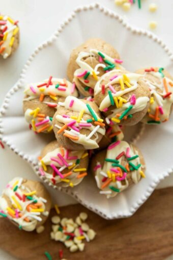 Top photo of birthday cake protein balls on a plate.