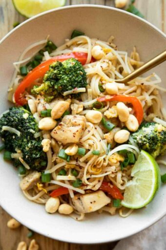 Easy Chicken Pad Thai recipe in a bowl with a fork.