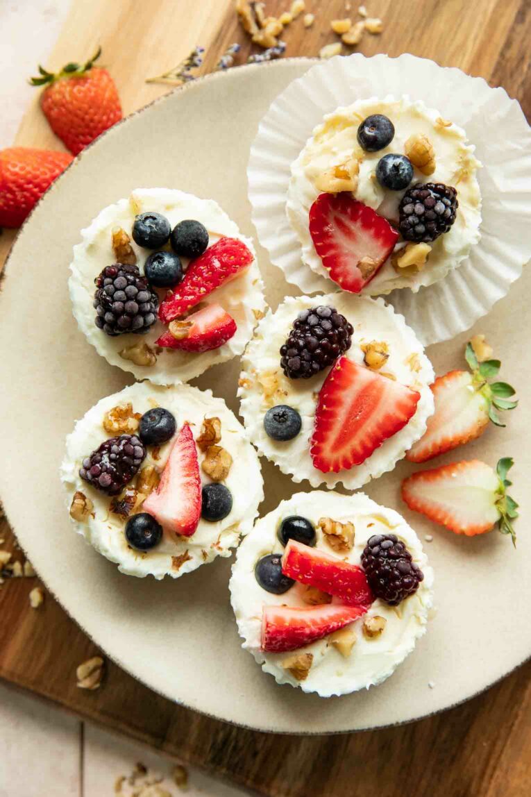 Frozen Yogurt Granola Cups on a plate with fruit.