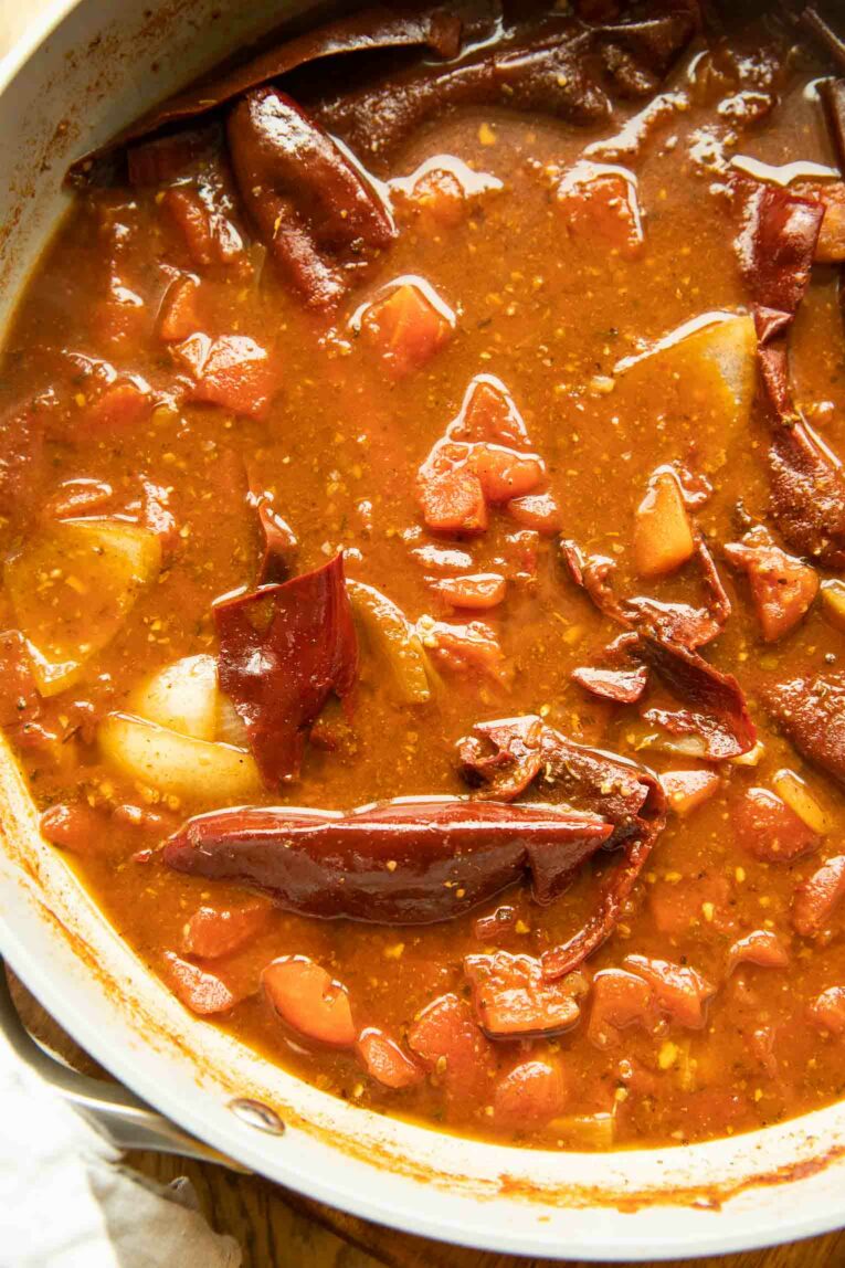 Close up of Birria sauce in a pan.