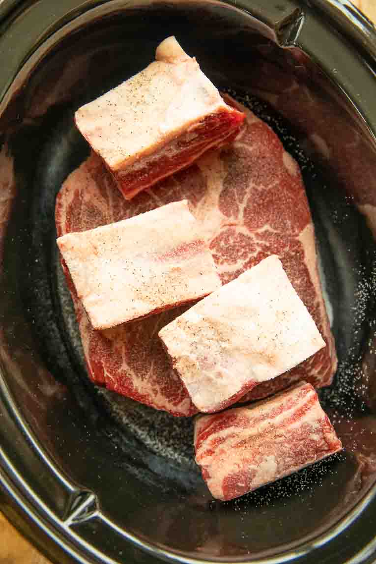 Birria meat in a crockpot.