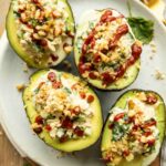 Top photo of Spicy Sriracha Tuna Stuffed Avocados on a plate.