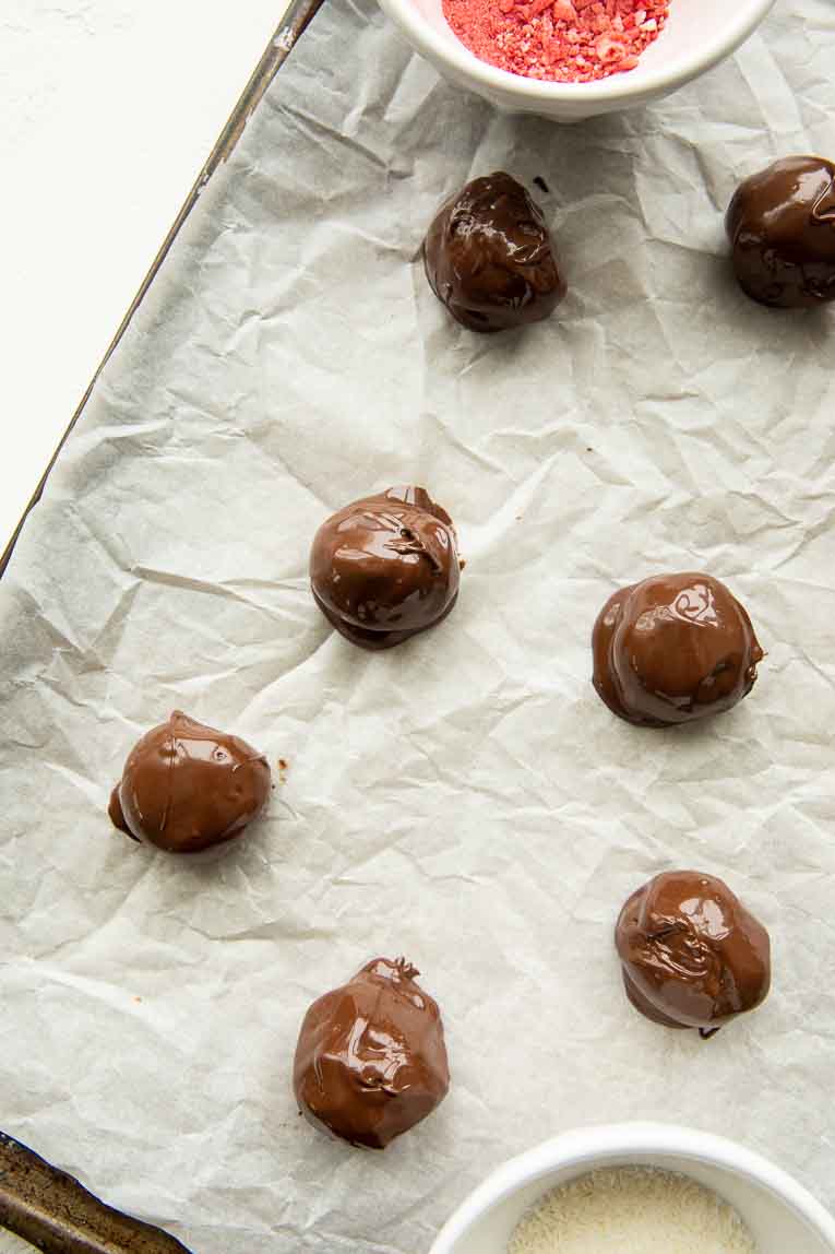 Chocolate bites on a baking sheet.