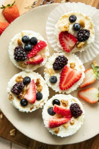 Frozen Yogurt Granola Cups on a plate with fruit.