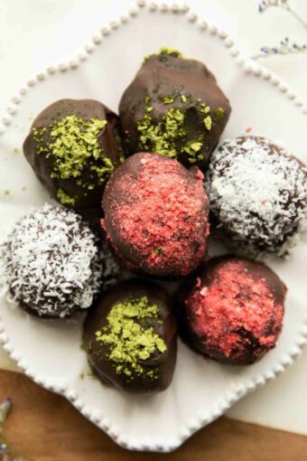 Superfood Chocolate Bites stacked on a plate.