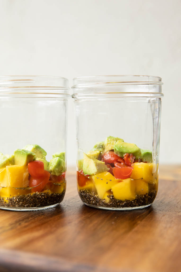 Fruit, chia seed vinaigrette, and avocado in a jar.