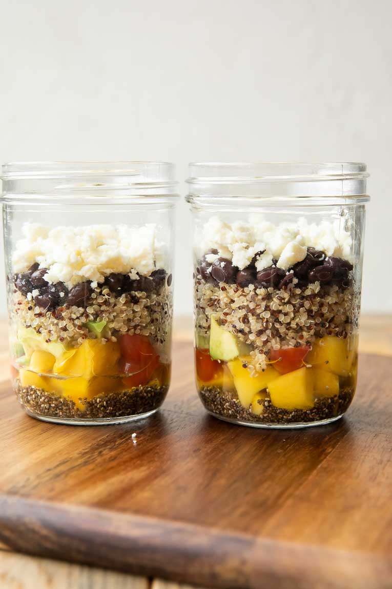 Layers of Central American Salad In A Jar being built.