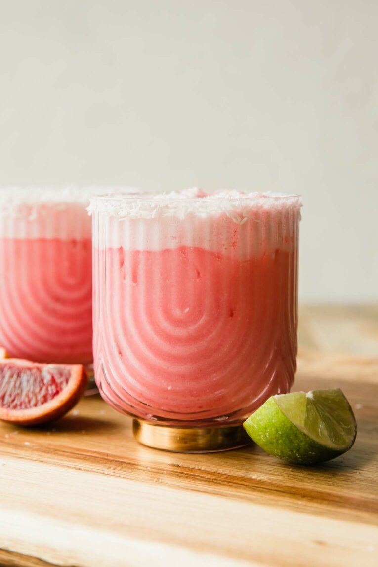 Creamy Blood Orange Mocktail in a glass with lime.