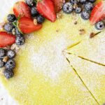 Vegan Berry Lemon Curd Tart recipe on parchment paper.