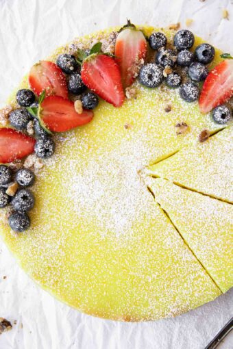 Vegan Berry Lemon Curd Tart recipe on parchment paper.