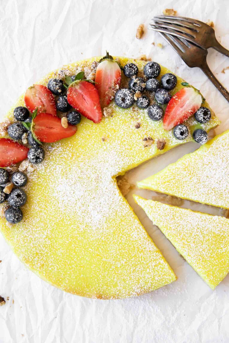 Top shot photo of Vegan Berry Lemon Curd Tart with forks.