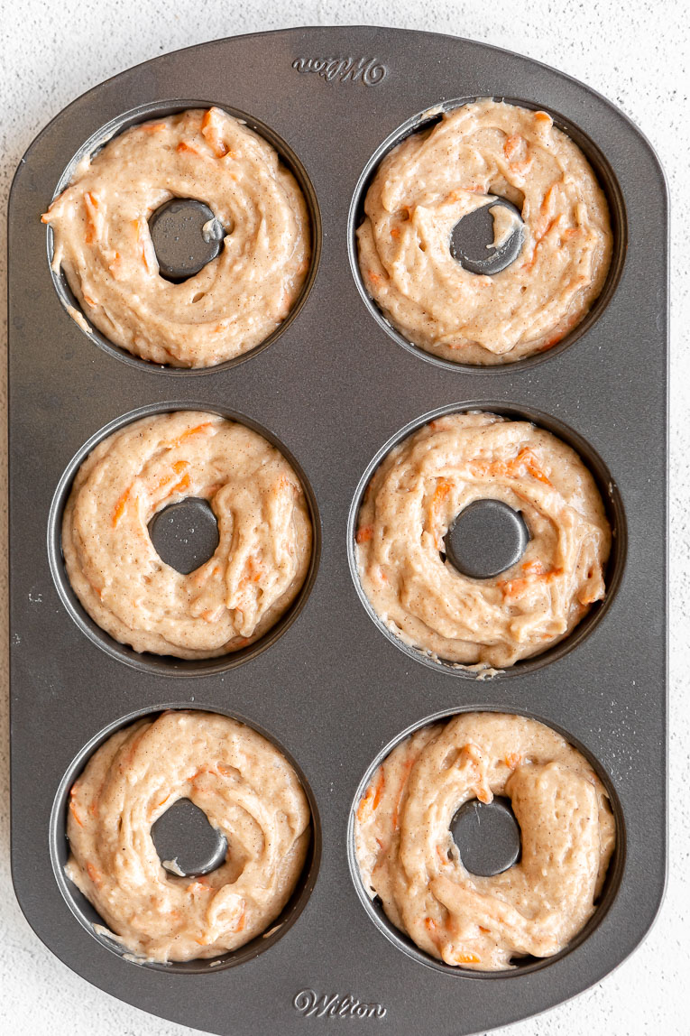 Vegan Carrot Cake Donuts batter in a donut pan.