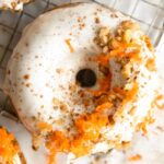 Top shot photo of Vegan Carrot Cake Donuts on a cooling rack.