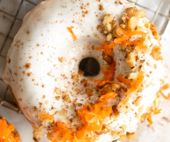 Top shot photo of Vegan Carrot Cake Donuts on a cooling rack.
