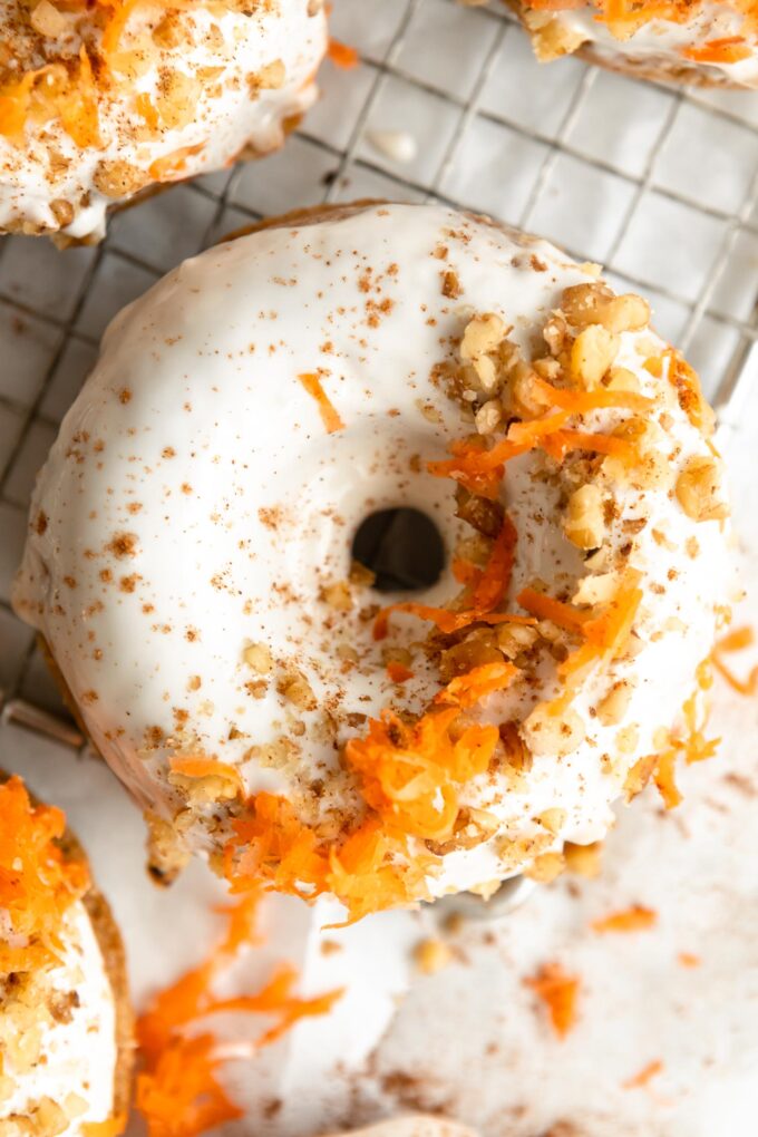 Top shot photo of Vegan Carrot Cake Donuts on a cooling rack.