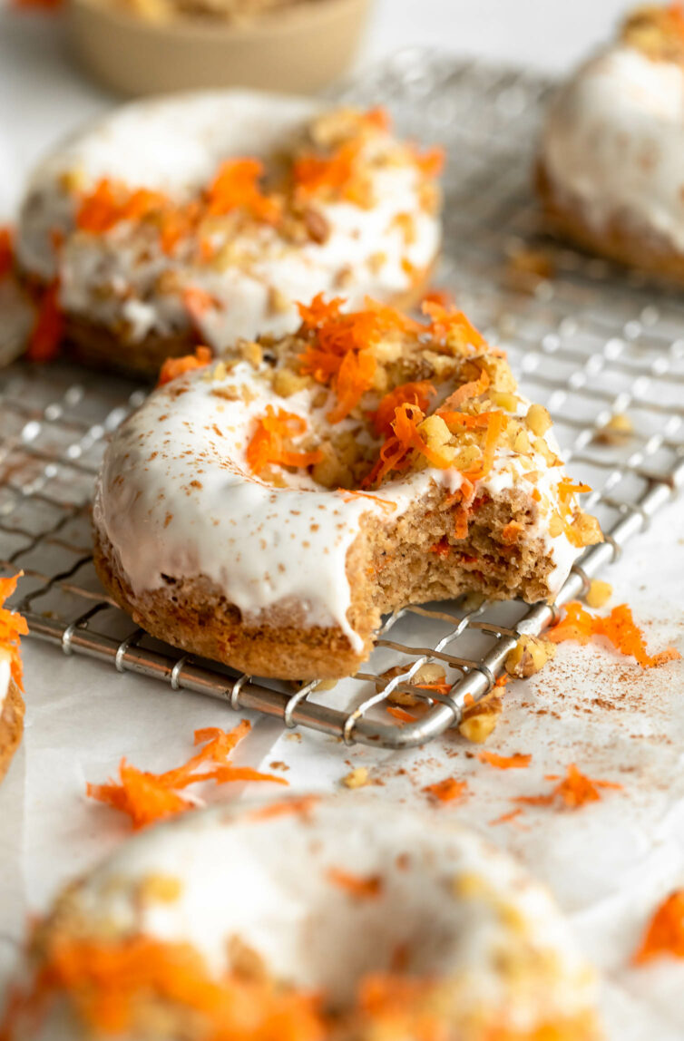 Vegan Carrot Cake Donuts on a cooling rack.