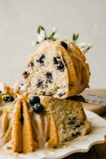 Slice of vegan lemon cake with blueberries.
