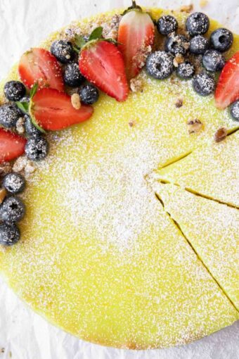 Vegan Berry Lemon Curd Tart recipe on parchment paper.