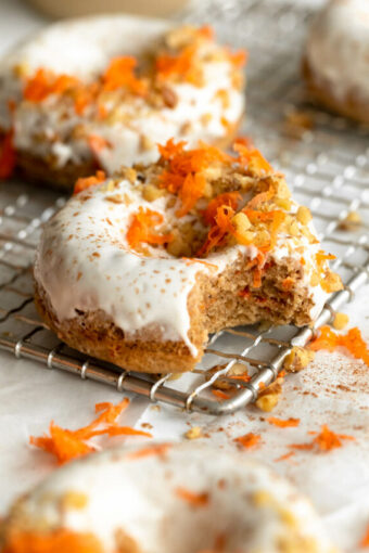 Vegan Carrot Cake Donuts on a cooling rack.
