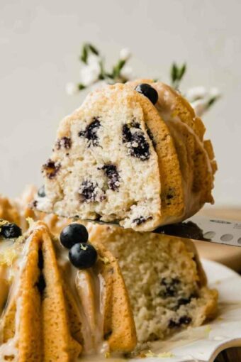 Slice of vegan lemon cake with blueberries.