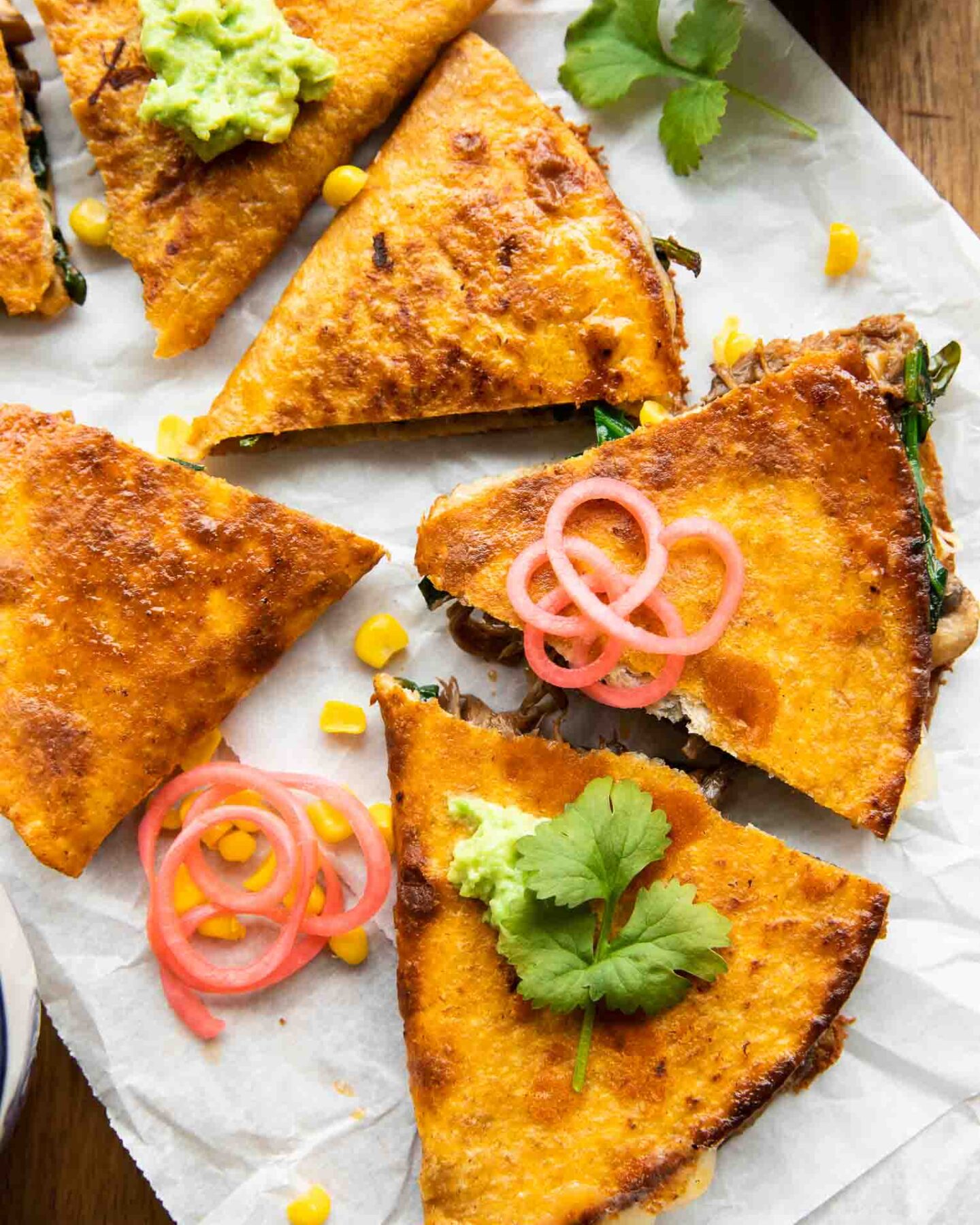 Birria Quesadillas with mushrooms, cheese, and cilantro.